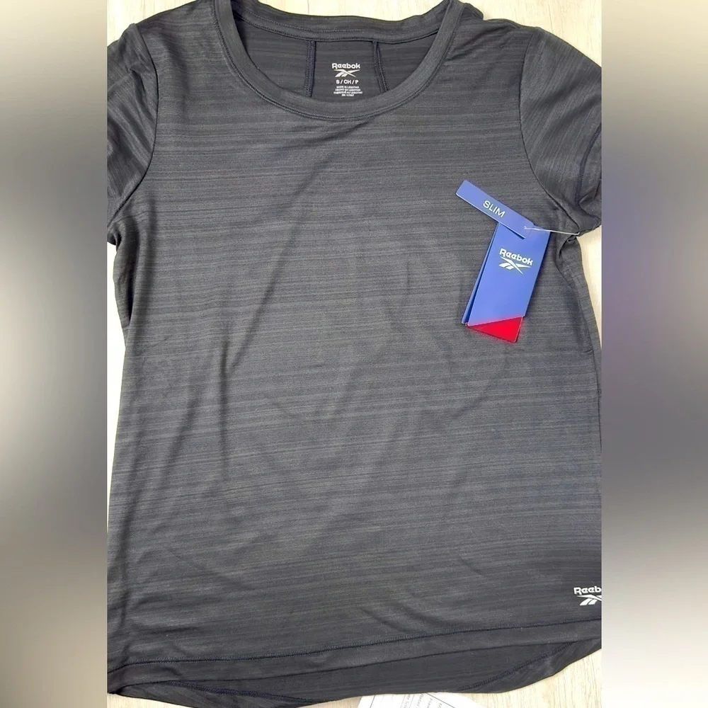 Reebok women’s small slim fit black athletic shirt​